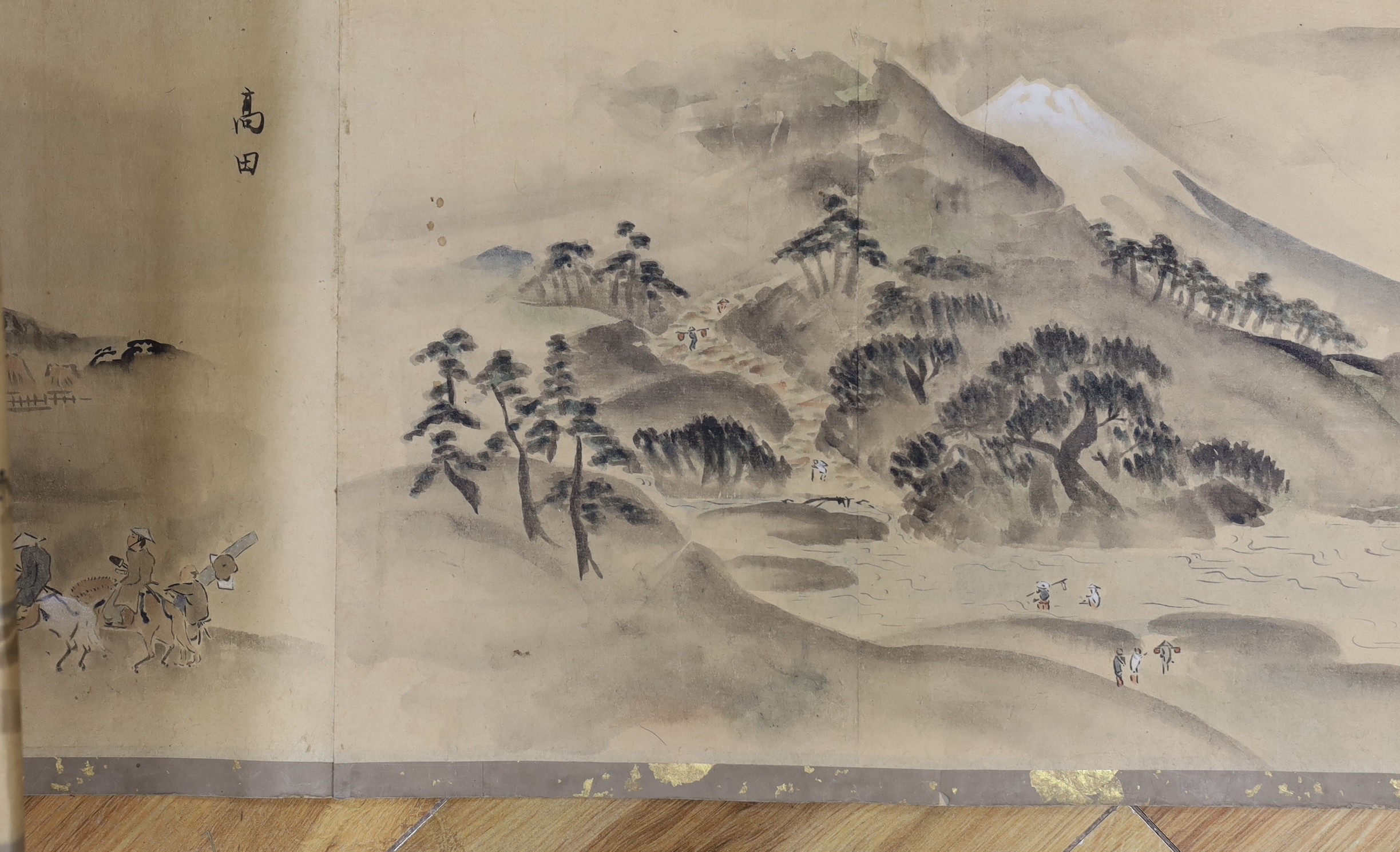 A Japanese landscape painting on paper hand scroll, Edo period, titled views, now in two parts, incomplete, image 27cm high x approximately 470cm wide